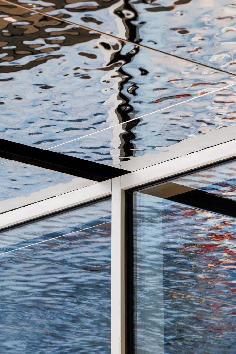 114 William Street — the rippled ceiling panels meeting the glazing, photographed after completion