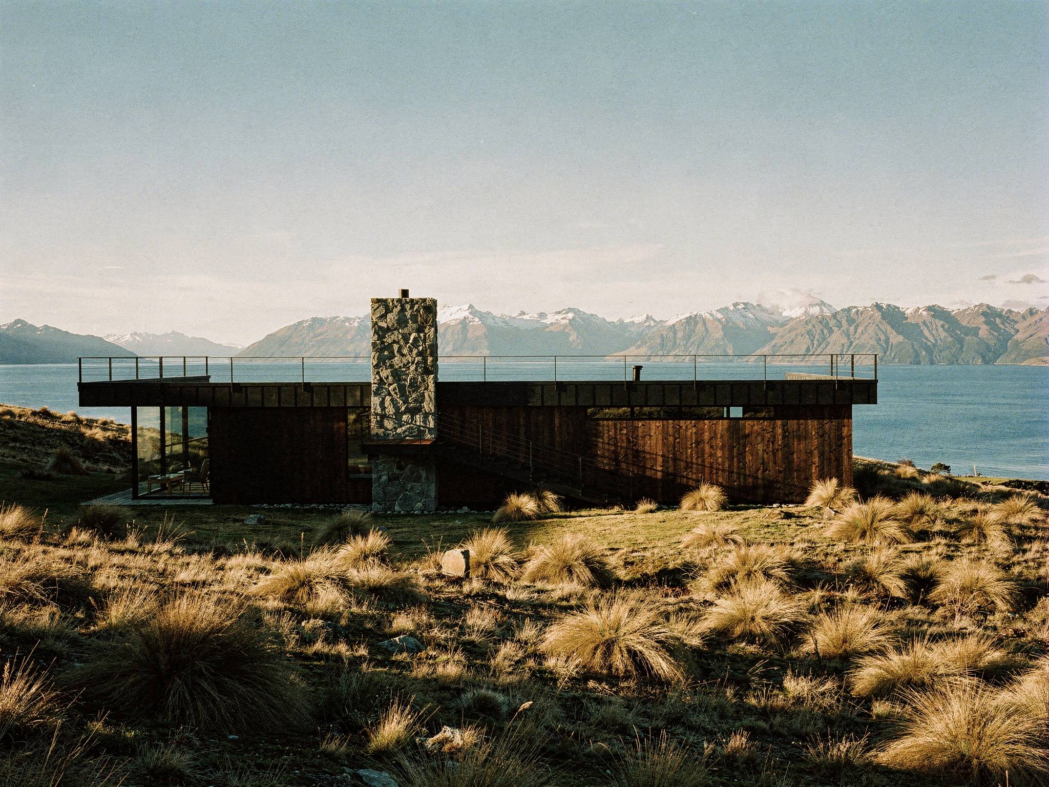 Timber and schist residence above Lake Wanaka at midday