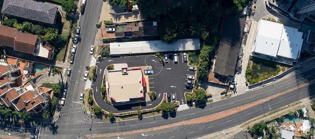 Proposed drive-thru massing photomontaged onto the survey aerial of the corner block