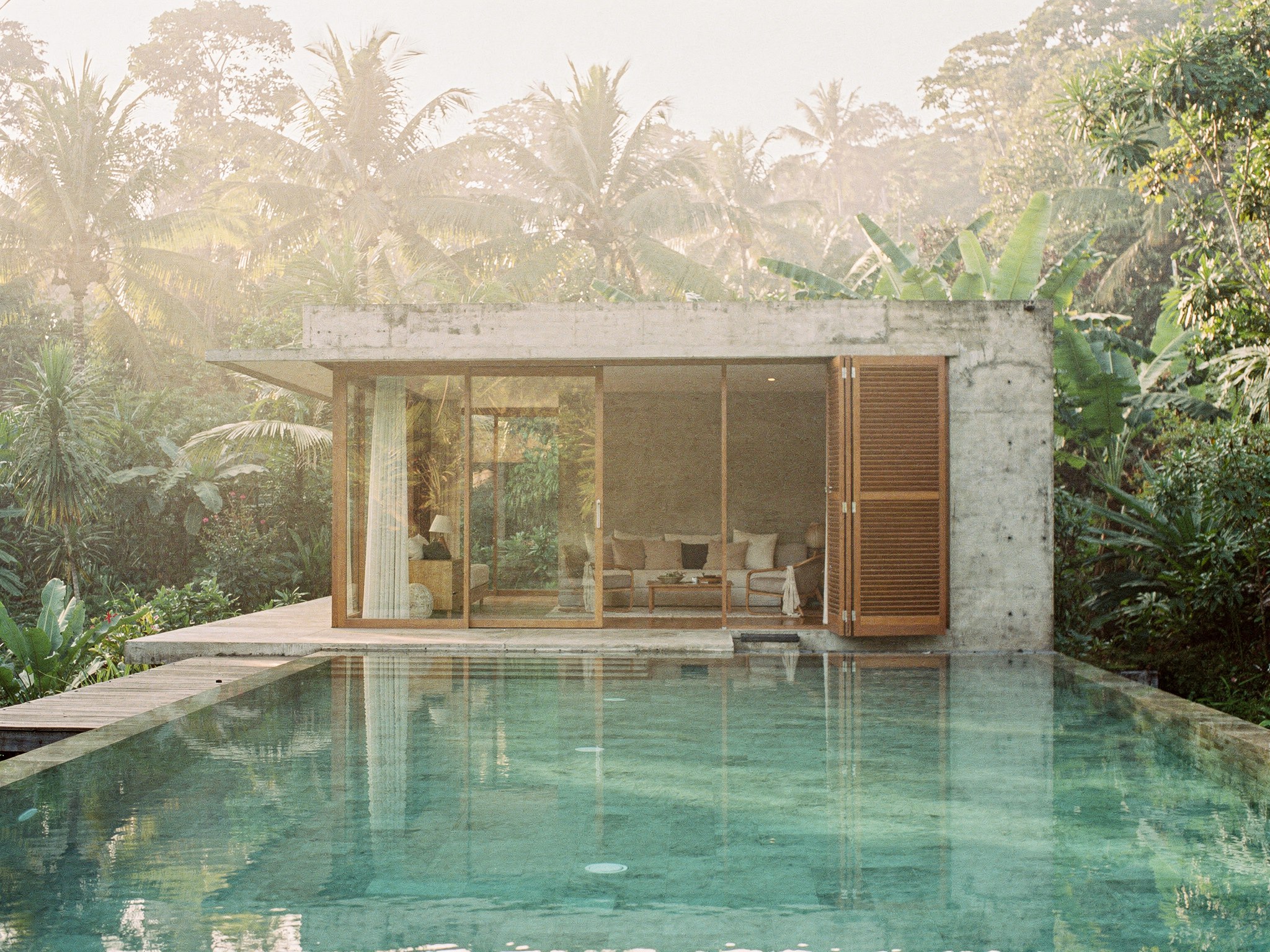 Sanara Wellness Retreat — jungle pavilions and vitality pool in morning mist